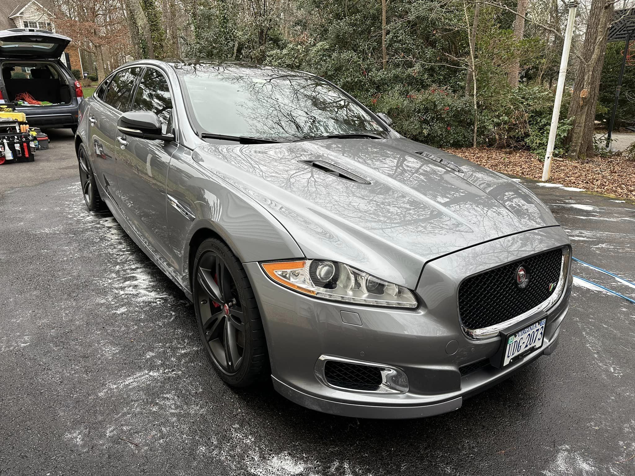 A shining silver Jaguar XJ