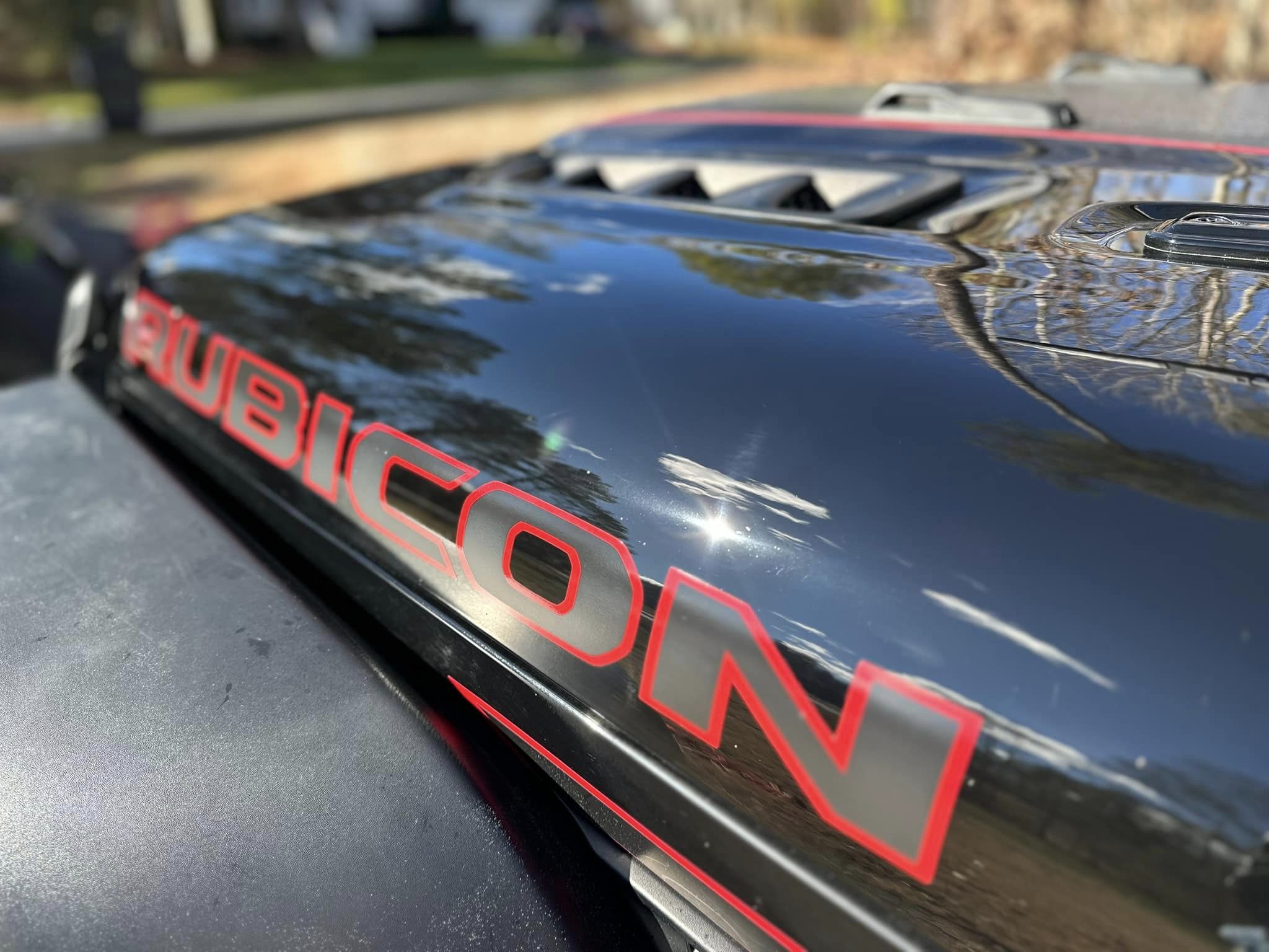 Close up of a Rubicon decal on a black Jeep