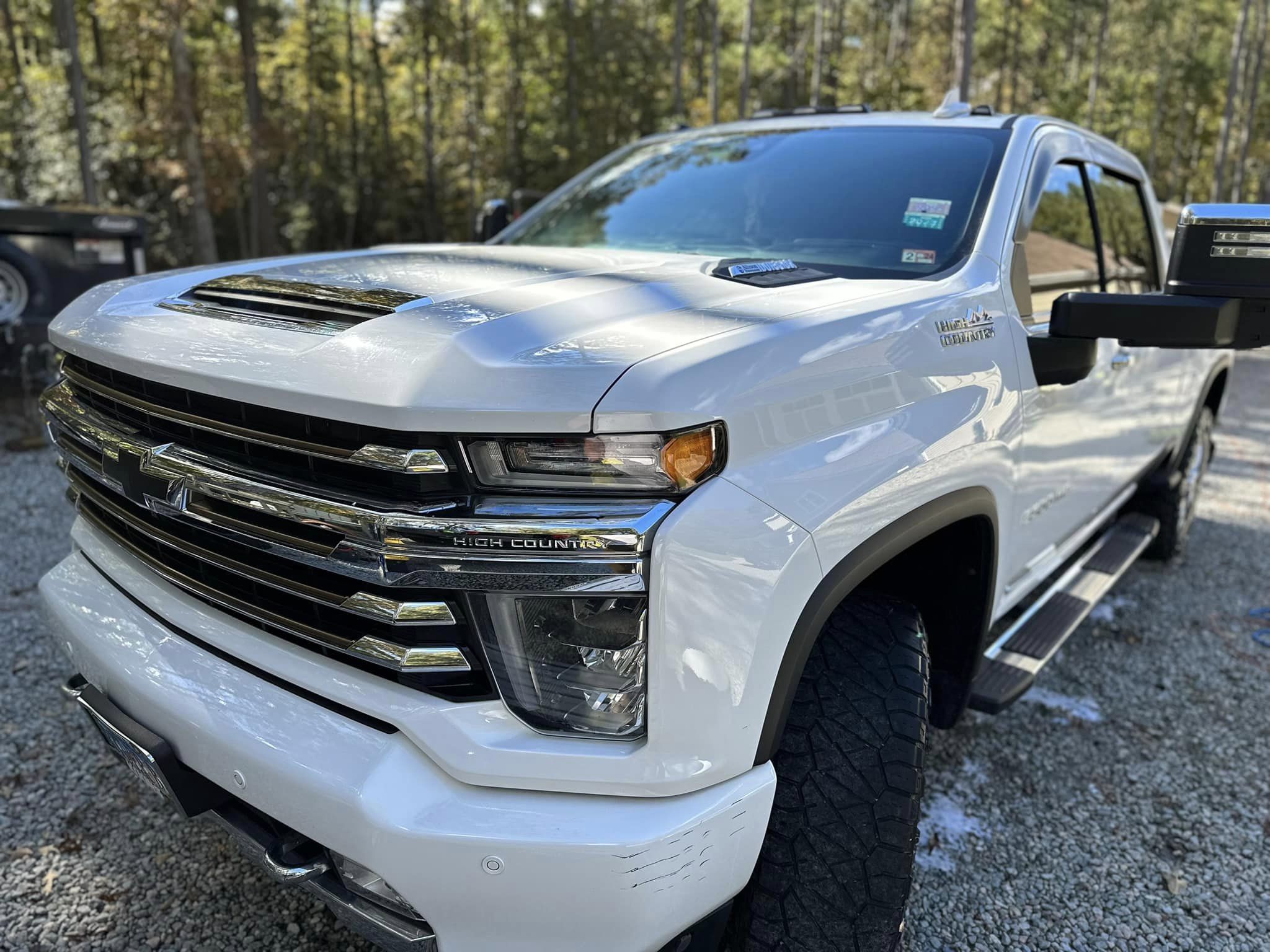 a stunning white chevy truck after a full exterior detail