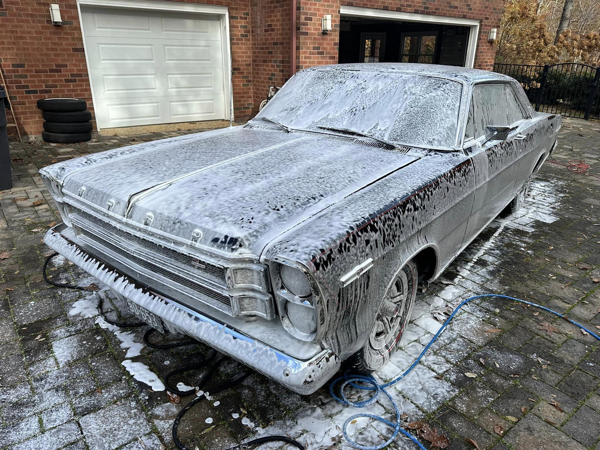 A black 66 Ford Galaxie, all soaped up 