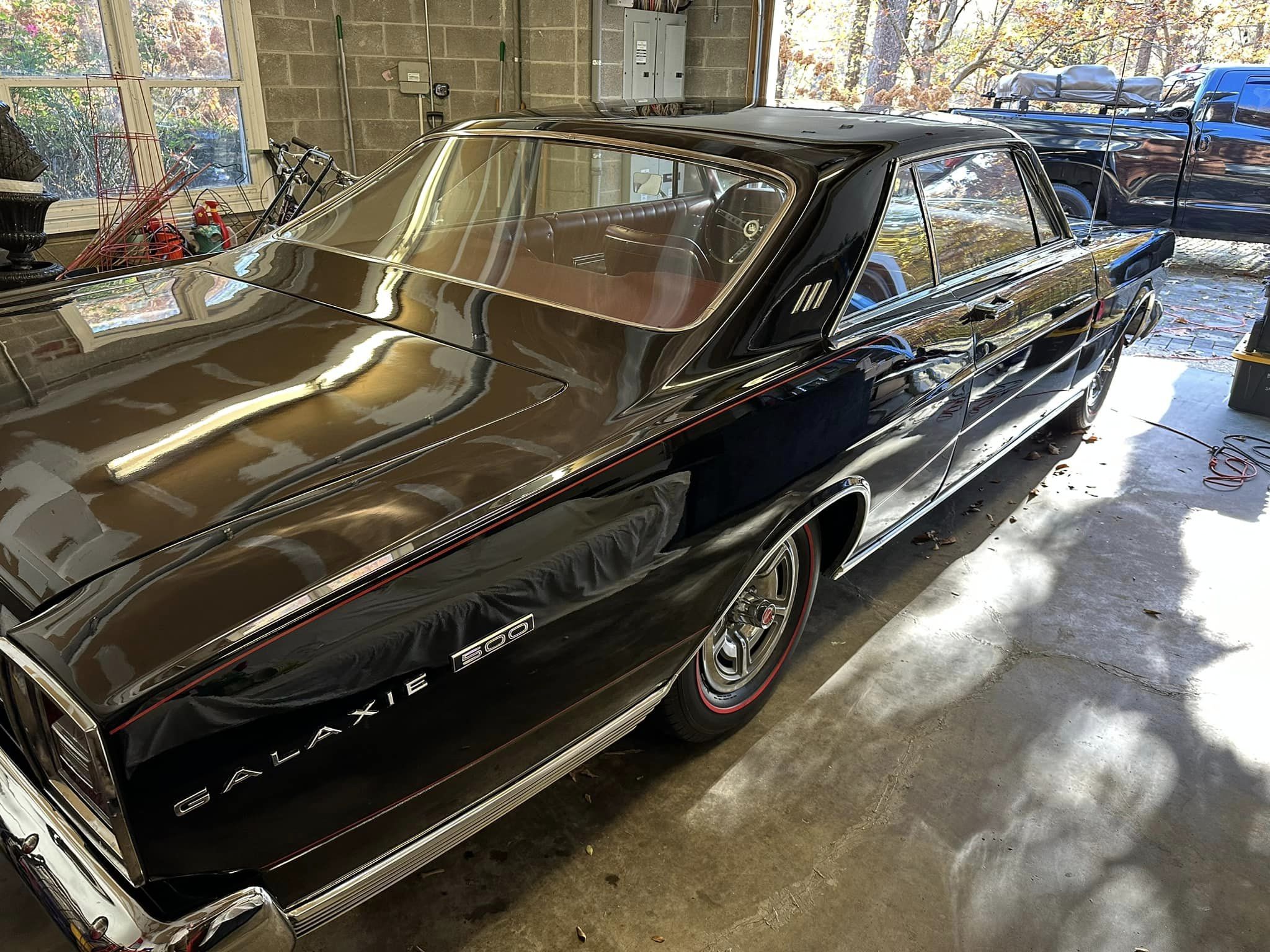 A black 66 Ford Galaxie, shot from right rear quarter panel