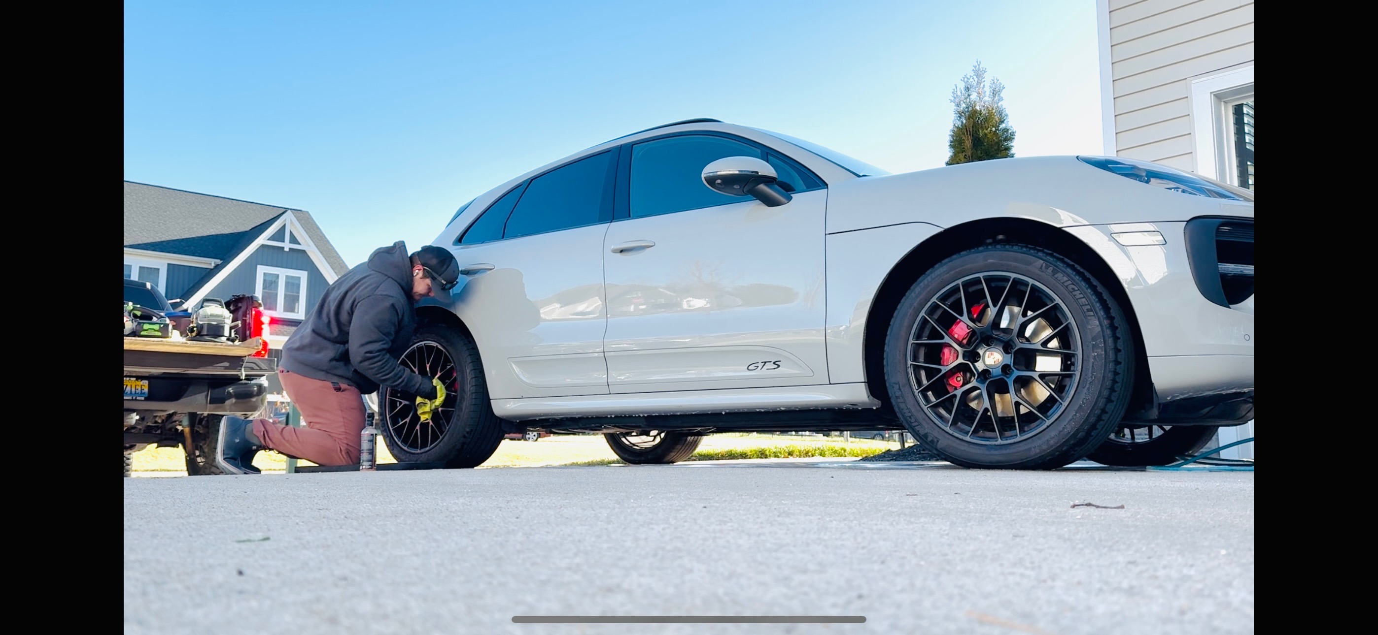 Parker detailing white Porsche Macan GTS wheels - mobile auto detailing service Chesterfield VA