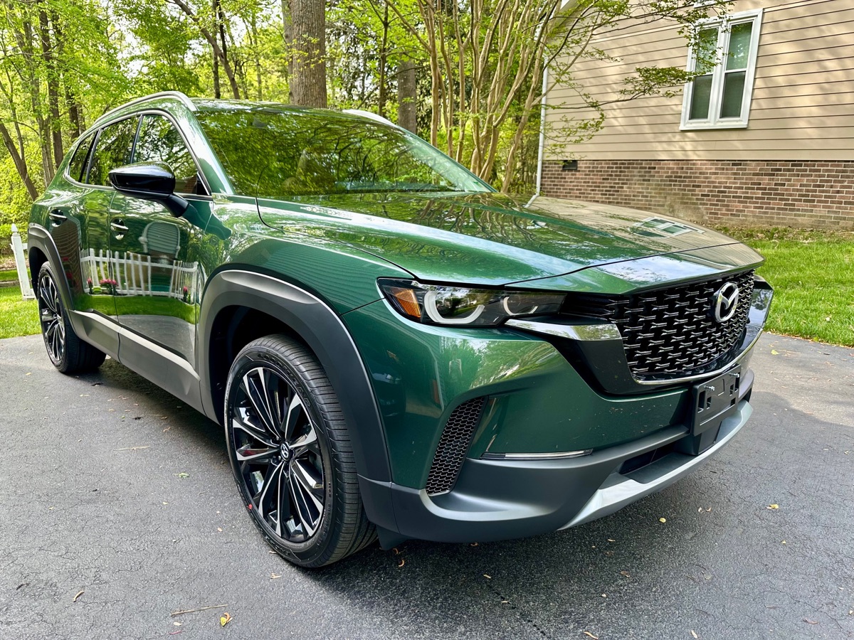 Green Mazda CX-50 with a glossy 5 year ceramic coating applied by Parker's Diamond Detailing